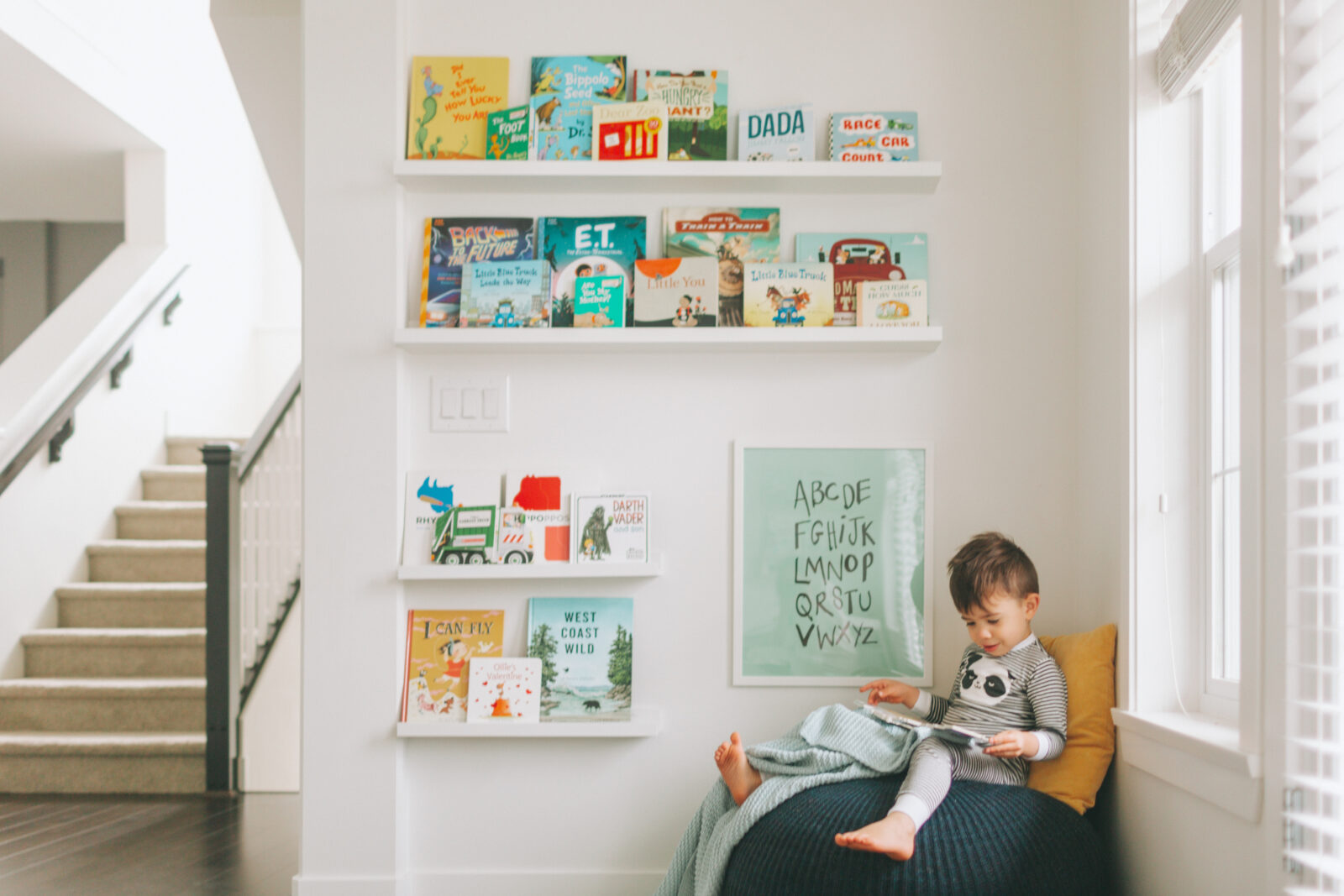White child bright boy toddler library reading home books minimal t20 096x LV