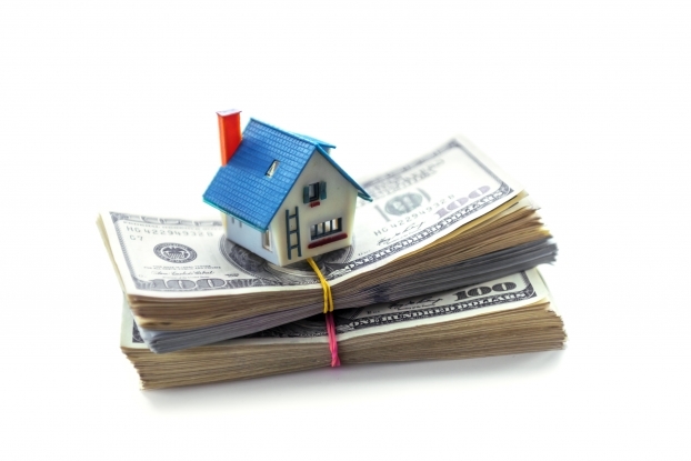 Bigstock house model on dollar cash sta 157593152 622 415 s